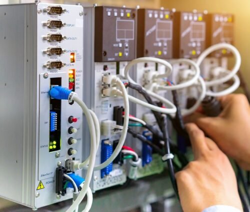 View of communication ports on servo controller in control box o PLC Controls For The Automation Industry - Automation Electric & Controls Inc